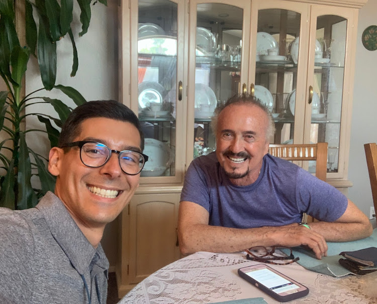 Daniel Hadobas reviewing a solar quote at a customer's kitchen table in Las Vegas